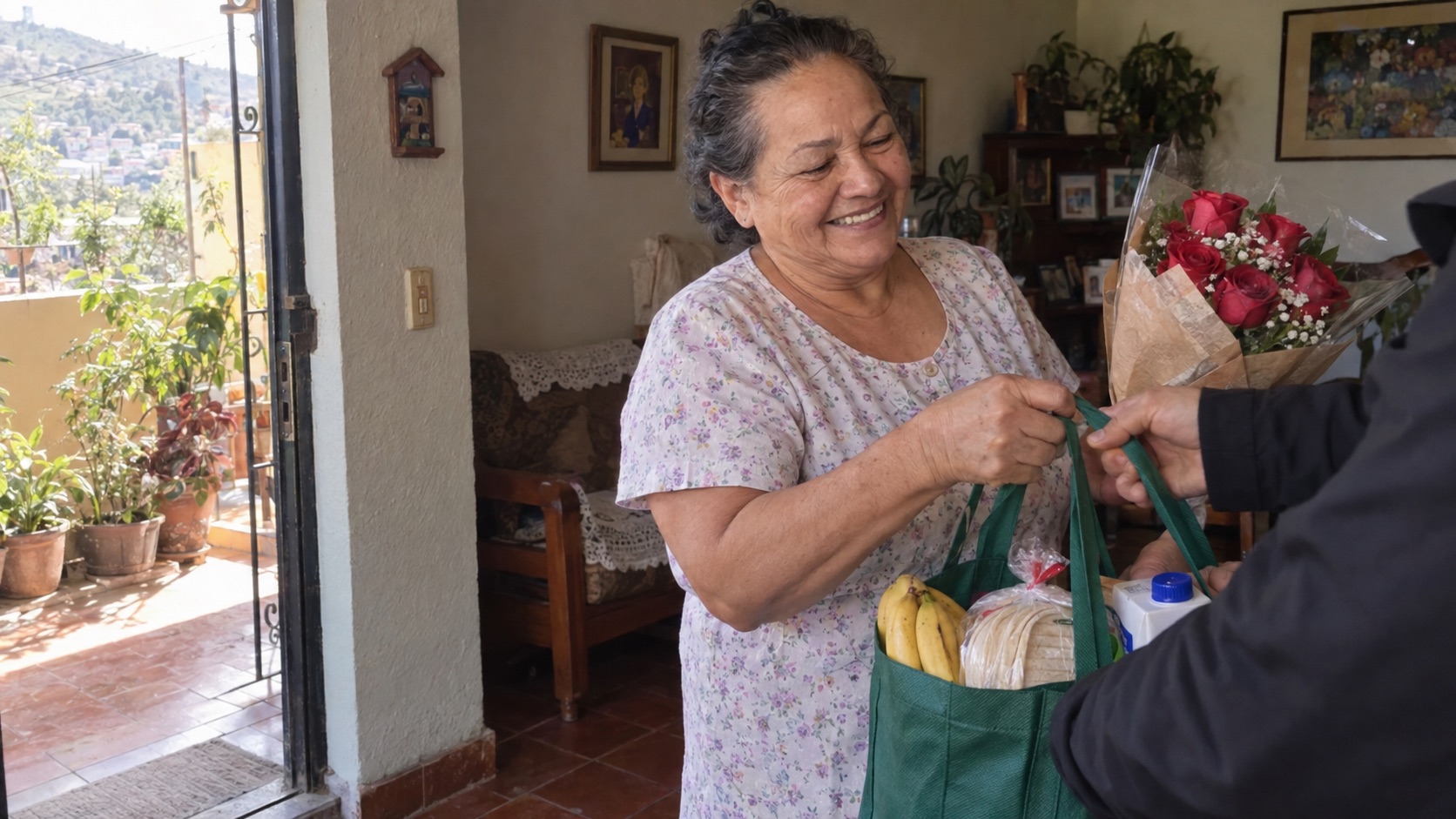 An older mother receiving groceries and flowers at her home in Tegucigalpa